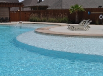 Castlegate II Community Pool with Tanning Ledge and Expansive Sundeck
