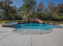 Freeform pool and spa with grotto and bubblers