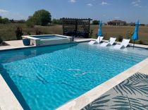 Geometric-Pool-with-Raised-Spa-Tanning-Ledge-and-Ledge-Loungers