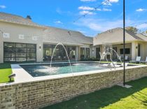 Geometric-pool-with-tanning-ledge-and-ledge-loungers1