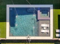 Geometric-pool-with-tanning-ledge-and-ledge-loungers3