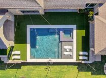 Geometric-pool-with-tanning-ledge-and-ledge-loungers5