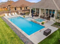 Geometric-pool-with-tanning-ledge-and-raised-spa