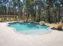 Custom Pool with Sheer Descent Floating Table and Sundeck 65-to-85K