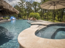 Freeform Pool and Spa with Rock Waterfall and Tanning Ledge 100K-and-above