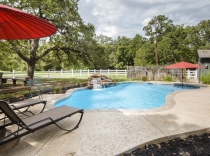 Freeform Swimming Pool with Rock Waterfall and Deck Jets 65K-to-80K
