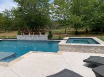 Custom-pool-and-spa-with-raised-wall-and-sheer-descents