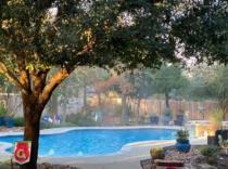 Freeform-pool-with-bubblers-and-raised-spa