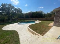 Freeform-pool-with-concrete-pool-deck-and-steps