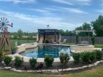 Freeform-pool-with-raised-spa-and-patio