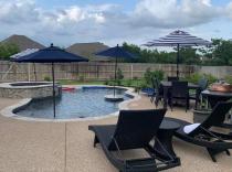 Freeform-pool-with-raised-spa-cocktail-table-and-kooldeck