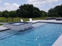 Geometric pool with raised spa