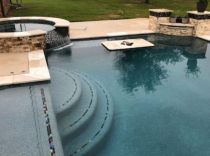 Geometric pool with raised spa