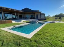 Geometric-pool-with-tanning-ledge-raised-spa-2