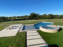Geometric-pool-with-tanning-ledge-raised-spa-3