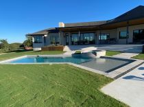 Geometric-pool-with-tanning-ledge-raised-spa