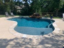 custom-pool-with-waterfall-and-tanning-ledge-min