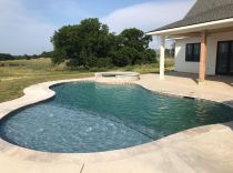 freeform-pool-and-spa-with-tanning-ledge-min