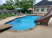 freeform-pool-with-diving-rock-and-slide
