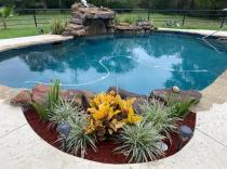freeform-pool-with-grotto-and-pool-landscaping