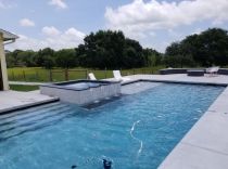 geometric-pool-with-raised-spa-bubblers-and-steps-min