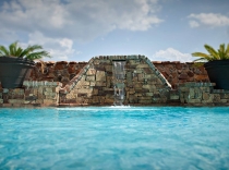 Handcrafted Stacked Stone Wall with Custom Water Scupper