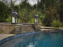 Stacked Stone Spa Spillover with Flagstone River Bed